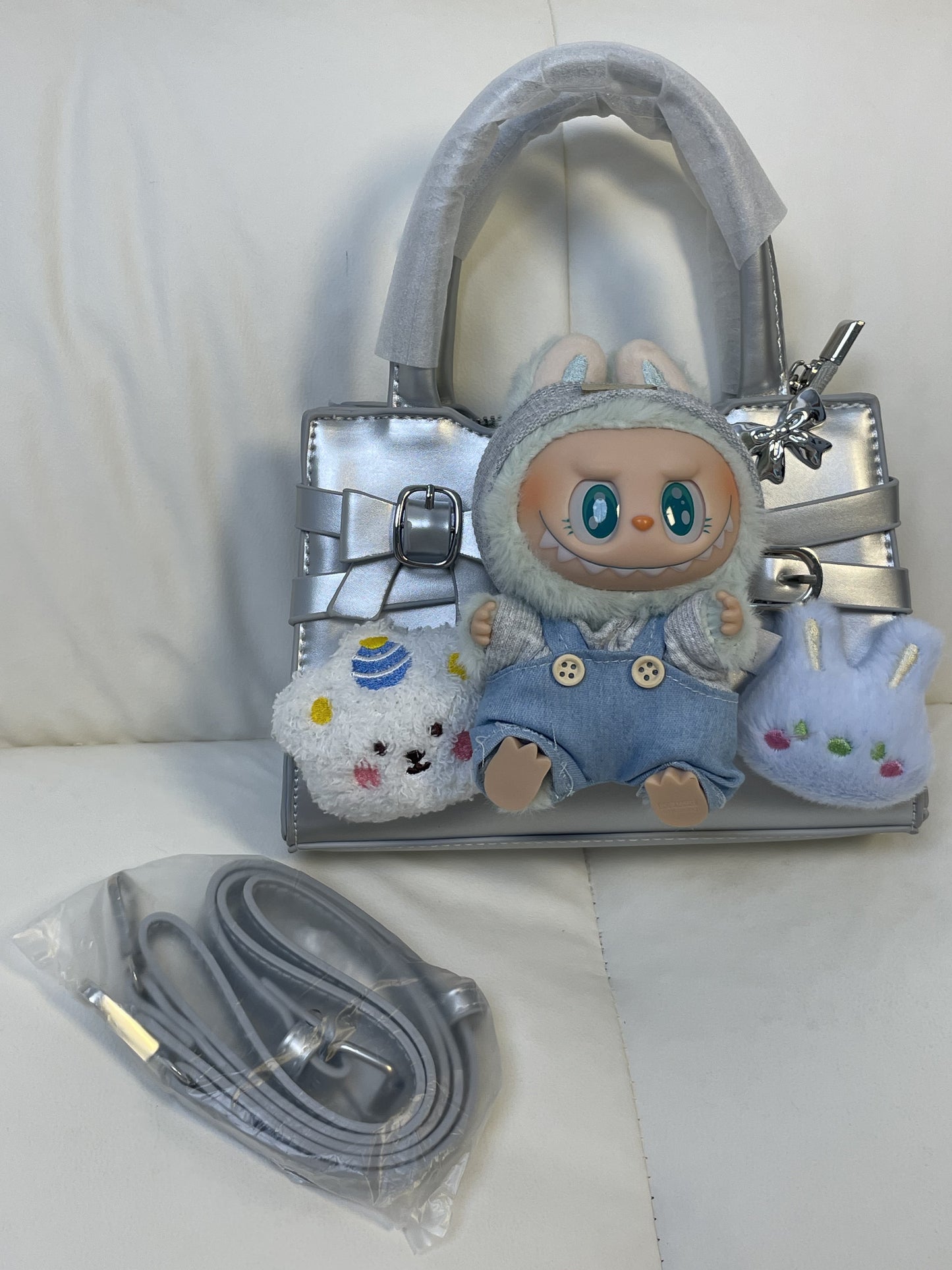 A fluffy stuffed toy bag with a JoJo exclusive feel!
