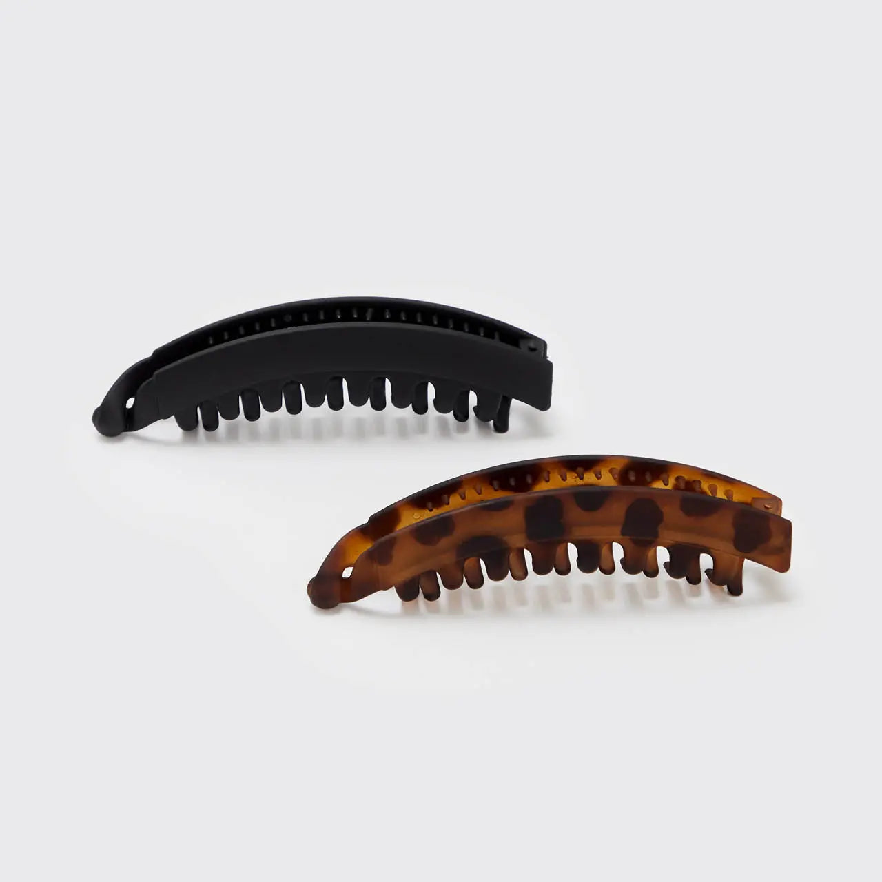 Pinza para el pelo 2 piezas - Negro y Tort, de plástico negro con diseño Tornado, ideal para almacenar alimentos